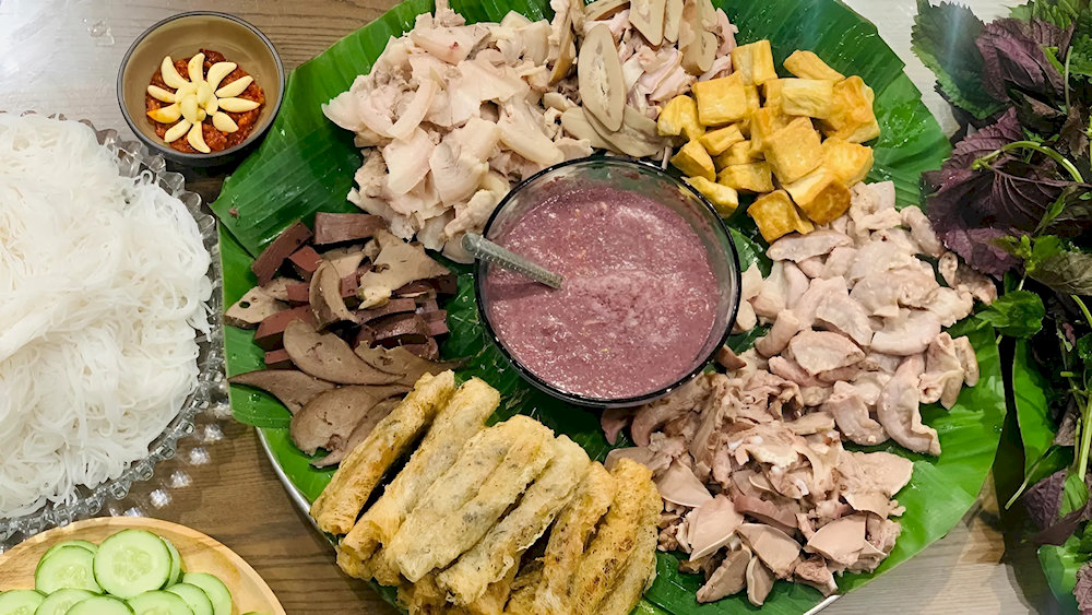 A tray of bun dau with a variety of delicious side dishes